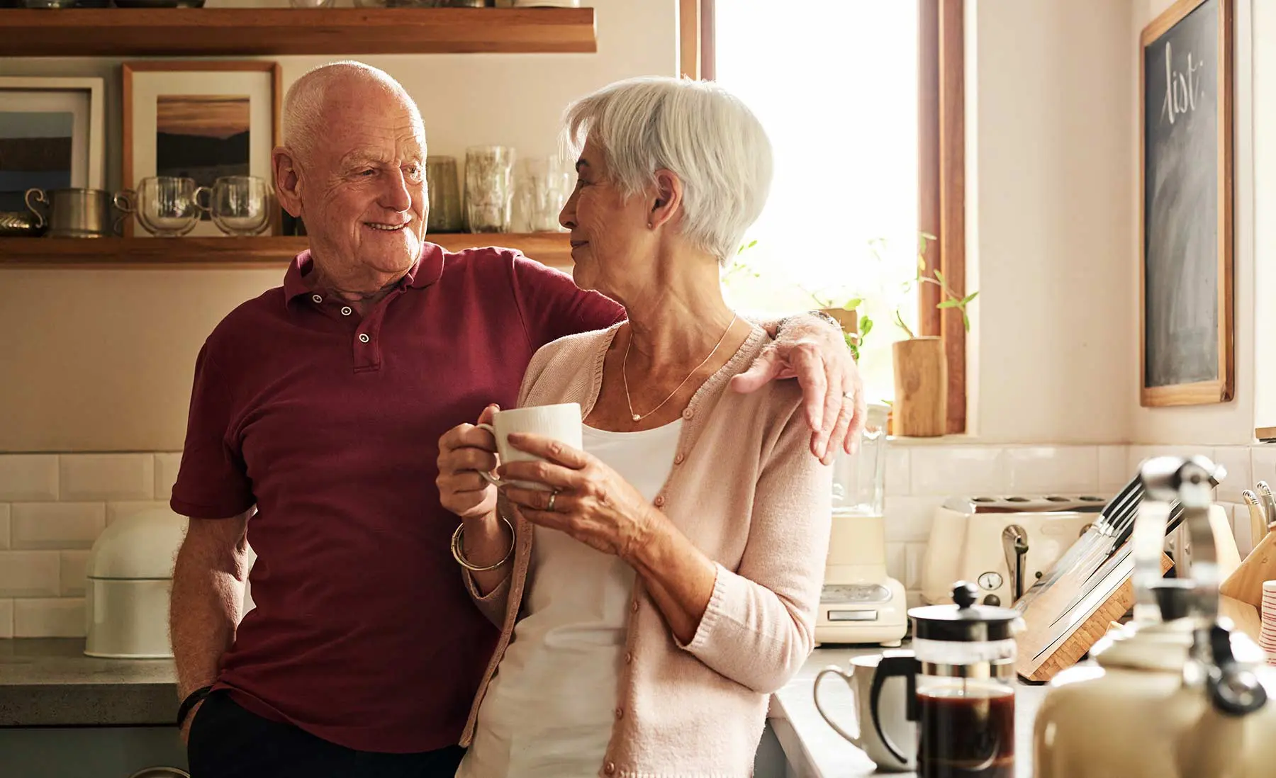 HomeOrCCRC_Blog senior couple having coffee in their kitchen