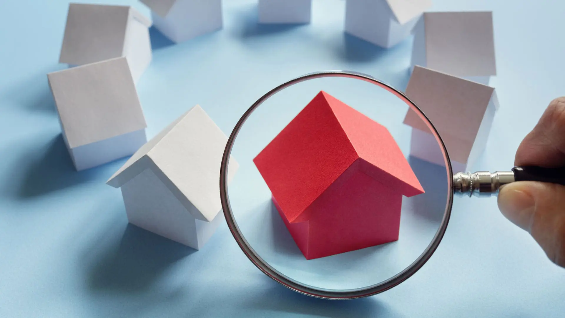 wooden houses with a magnifying glass