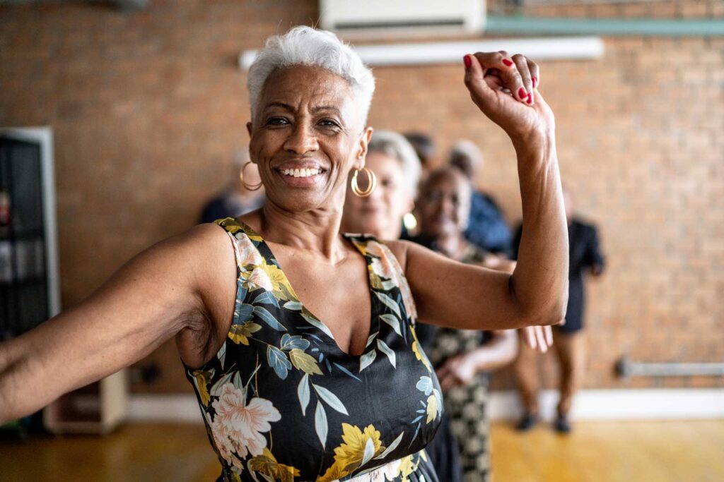 senior woman dancing in a dance class