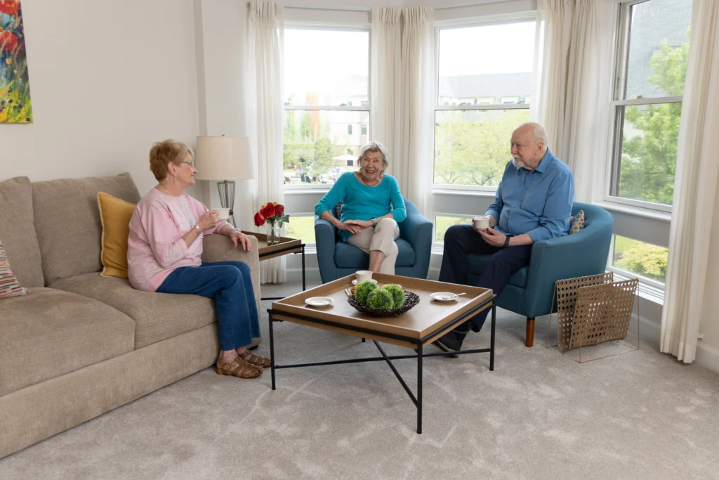 senior women and senior man enjoying living room